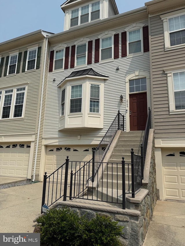 2066 Capstone Cir, Herndon, VA 20170 - townhome / multi-family property featuring a garage and driveway
