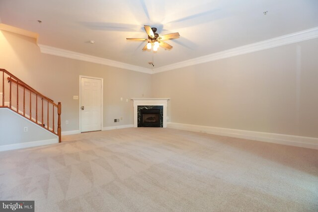 2066 Capstone Cir, Herndon, VA 20170 - unfurnished living room with ceiling fan, crown molding, stairs, light carpet, and a high end fireplace