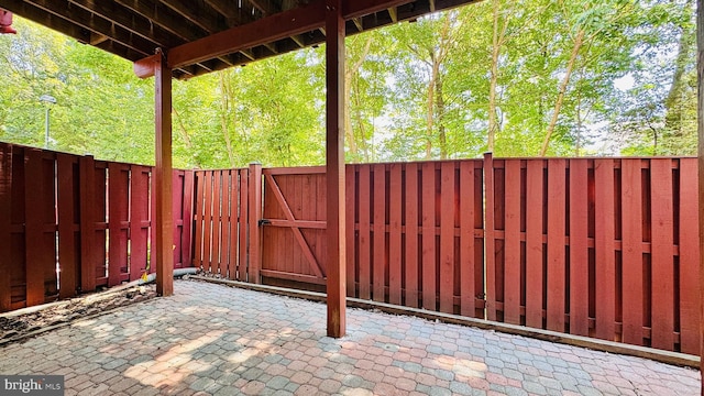 2066 Capstone Cir, Herndon, VA 20170 - fenced backyard with a gate and a patio area
