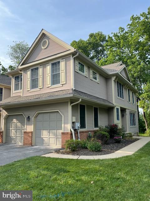 166 Neil Ct, Princeton, NJ 08540 - townhome / multi-family property featuring a garage, a front yard, brick siding, and driveway