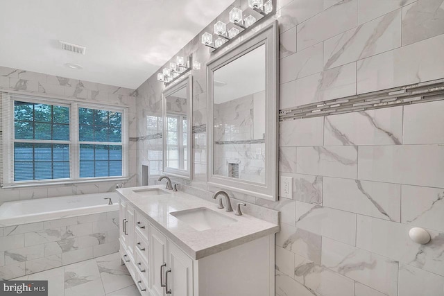 166 Neil Ct, Princeton, NJ 08540 - full bathroom featuring a garden tub, tile walls, marble look tiles, and double vanity
