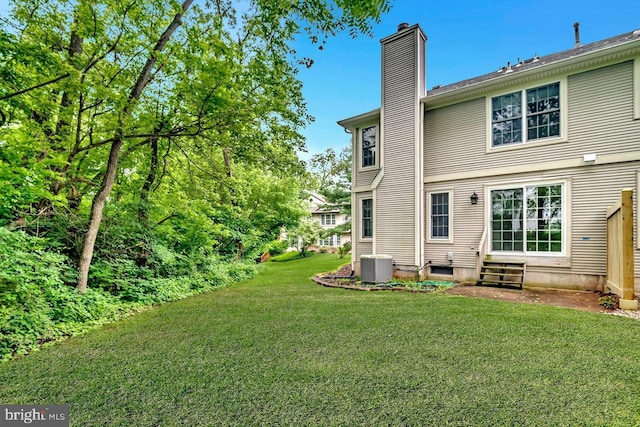 166 Neil Ct, Princeton, NJ 08540 - rear view of house with entry steps, a chimney, and a yard