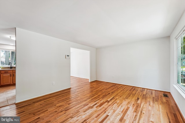 4376 Rock Ct, Waldorf, MD 20602 - empty room featuring light wood-style flooring and plenty of natural light