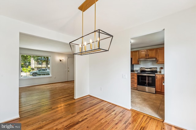 4376 Rock Ct, Waldorf, MD 20602 - unfurnished dining area featuring a chandelier and light wood-style flooring