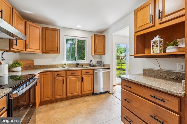 4376 Rock Ct, Waldorf, MD 20602 - kitchen featuring appliances with stainless steel finishes, exhaust hood, light tile patterned floors, light stone countertops, and brown cabinetry