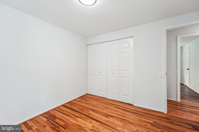 4376 Rock Ct, Waldorf, MD 20602 - unfurnished bedroom featuring wood finished floors and a closet