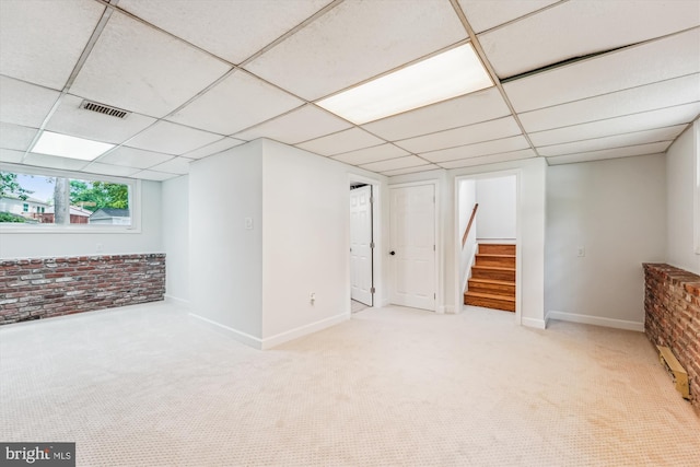 4376 Rock Ct, Waldorf, MD 20602 - basement with carpet, a drop ceiling, stairway, and brick wall