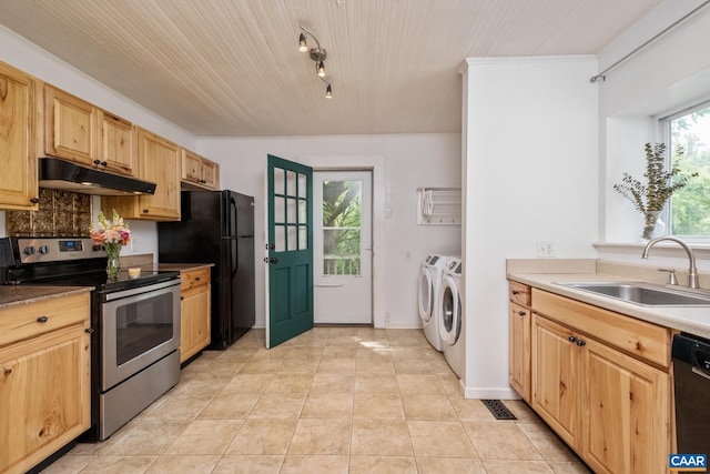 343 Burnt Tree Way, Orange, VA 22960 - kitchen with black appliances, washer and dryer, under cabinet range hood, light brown cabinetry, and light tile patterned flooring