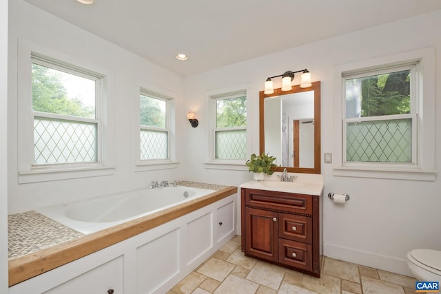 343 Burnt Tree Way, Orange, VA 22960 - bathroom with vanity, a bath, stone tile flooring, and recessed lighting