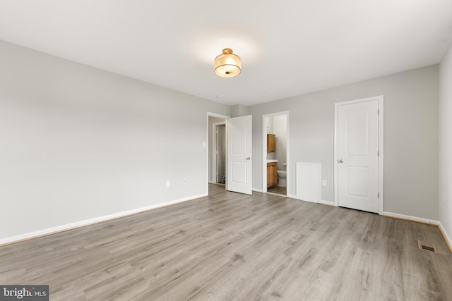 8995 Patterson Pl, Manassas, VA 20110 - unfurnished bedroom featuring light wood finished floors and ensuite bath
