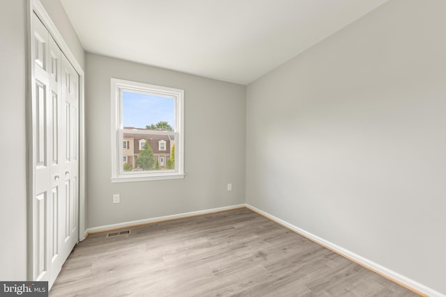 8995 Patterson Pl, Manassas, VA 20110 - unfurnished bedroom featuring a closet and light wood-style flooring