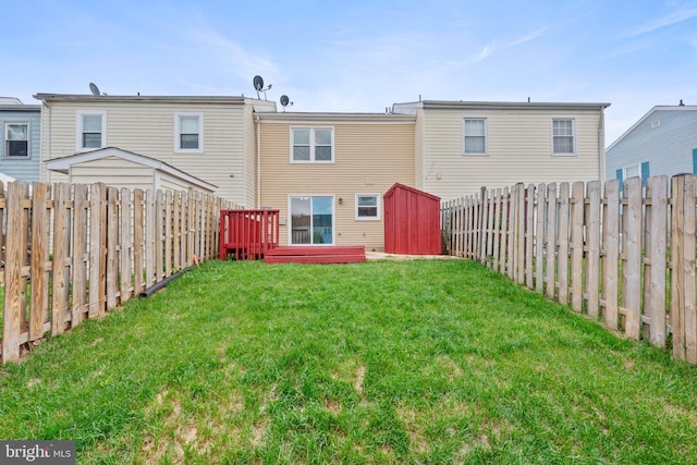 8995 Patterson Pl, Manassas, VA 20110 - rear view of house featuring a fenced backyard, a deck, and a storage shed