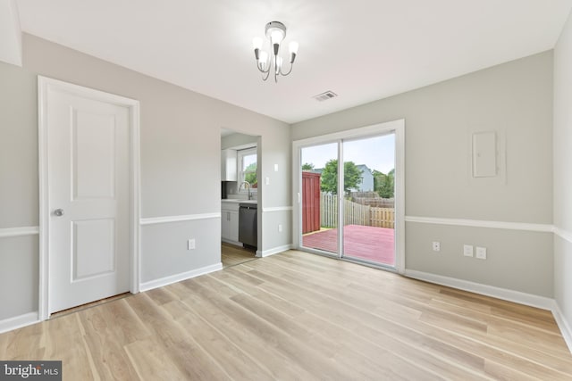8995 Patterson Pl, Manassas, VA 20110 - unfurnished room with a chandelier and light wood finished floors