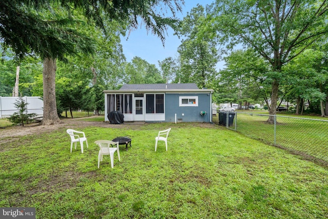 3519 Sunset Ave, Williamstown, NJ 08094 - rear view of house featuring a sunroom, a fenced backyard, and a fire pit