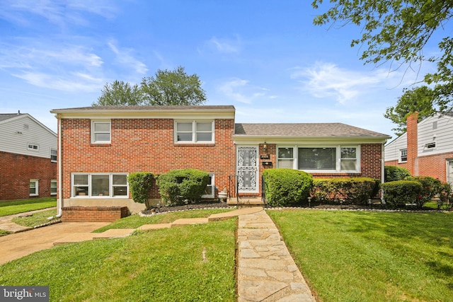 8328 Merrymount Dr, Baltimore, MD 21244 - split level home featuring a front lawn and brick siding