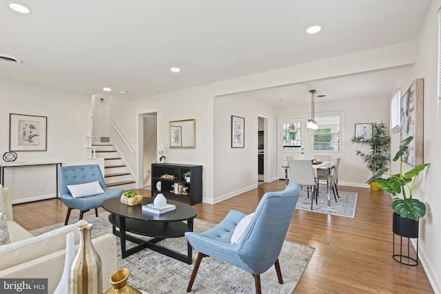 8328 Merrymount Dr, Baltimore, MD 21244 - living area with recessed lighting, stairs, and wood finished floors