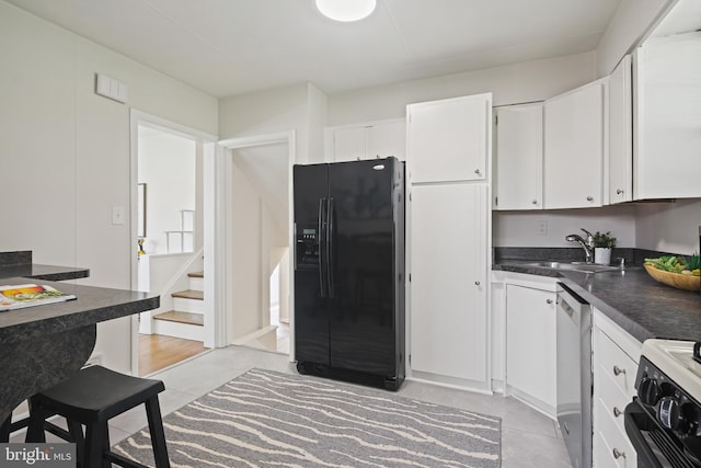 8328 Merrymount Dr, Baltimore, MD 21244 - kitchen featuring black fridge, dark countertops, white cabinets, and stove