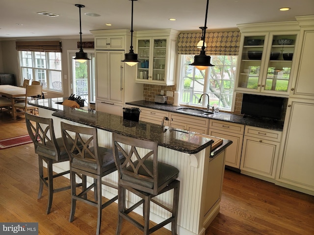 2424 Stanwick Rd, Phoenix, MD 21131 - kitchen featuring cream cabinetry, dark wood-type flooring, tasteful backsplash, and recessed lighting