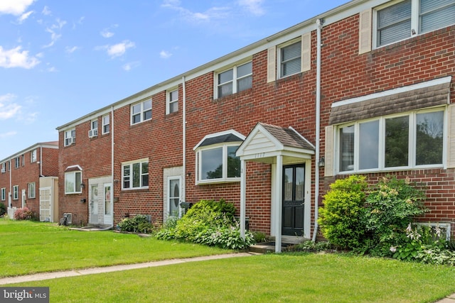 1117 Regina Dr, Baltimore, MD 21227 - back of property with brick siding and a lawn