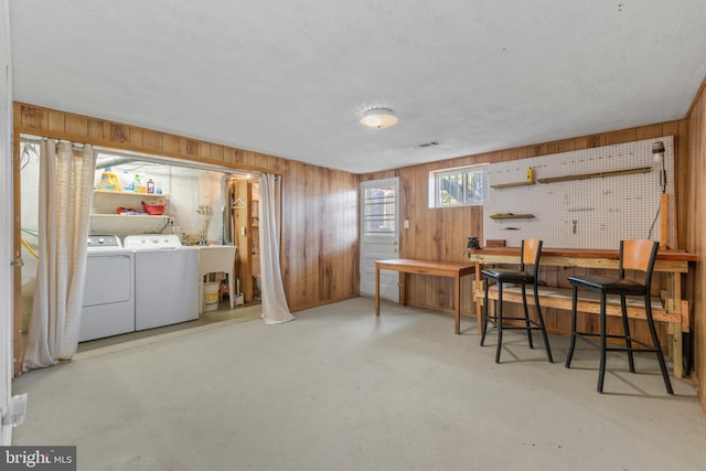 1117 Regina Dr, Baltimore, MD 21227 - dining room with wood walls and washer and clothes dryer