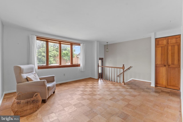 1117 Regina Dr, Baltimore, MD 21227 - living area with an upstairs landing and baseboards