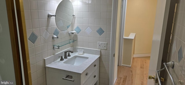 350 Juniper Ct, Herndon, VA 20170 - half bath featuring wood finished floors, vanity, and tile walls