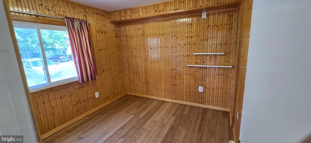 350 Juniper Ct, Herndon, VA 20170 - empty room featuring wood finished floors, healthy amount of natural light, and wooden walls