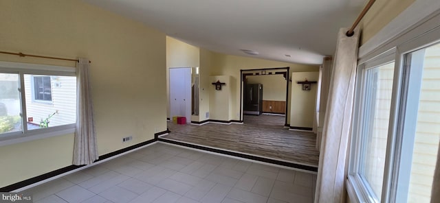 350 Juniper Ct, Herndon, VA 20170 - tiled spare room featuring lofted ceiling and baseboards