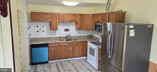 350 Juniper Ct, Herndon, VA 20170 - kitchen with appliances with stainless steel finishes, brown cabinets, light wood-type flooring, and light stone counters