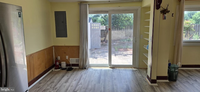 350 Juniper Ct, Herndon, VA 20170 - doorway to outside featuring electric panel, wood finished floors, a wainscoted wall, and wood walls