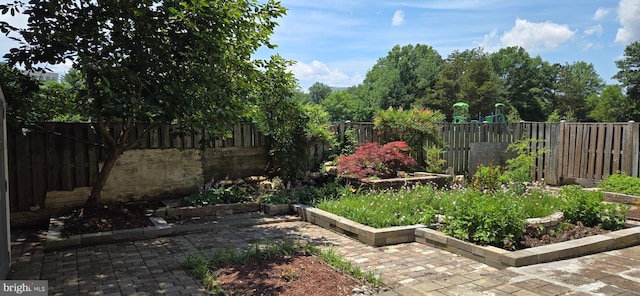 350 Juniper Ct, Herndon, VA 20170 - fenced backyard featuring a garden and a patio area