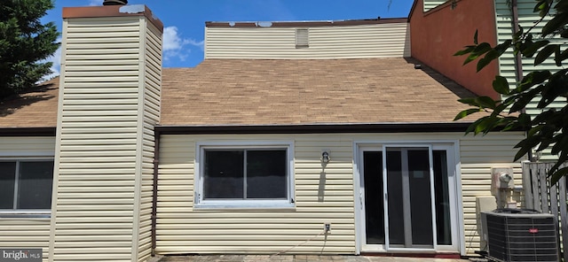 350 Juniper Ct, Herndon, VA 20170 - back of house featuring a shingled roof and a chimney