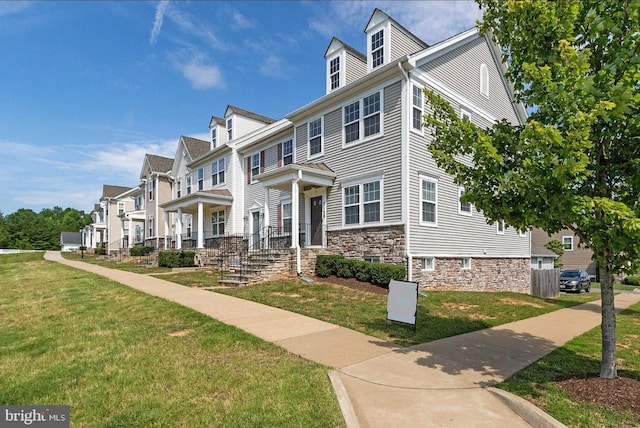 7129 Durrette Rd, Ruther Glen, VA 22546 - multi unit property with a front yard, a residential view, and stone siding