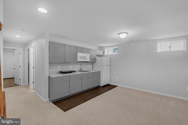 7129 Durrette Rd, Ruther Glen, VA 22546 - kitchen featuring white appliances, gray cabinetry, and dark colored carpet