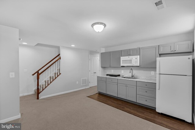 7129 Durrette Rd, Ruther Glen, VA 22546 - kitchen featuring white appliances, gray cabinetry, light countertops, dark carpet, and recessed lighting