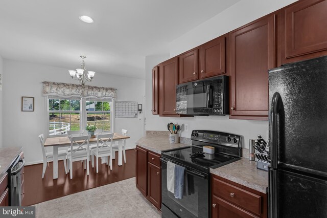 7129 Durrette Rd, Ruther Glen, VA 22546 - kitchen with black appliances, a chandelier, light countertops, decorative light fixtures, and recessed lighting