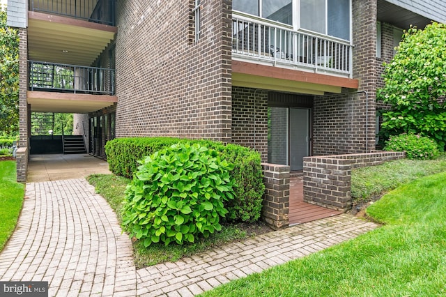 2 Stonehenge Cir Unit 2A-2, Baltimore, MD 21208 - property entrance with a balcony and brick siding