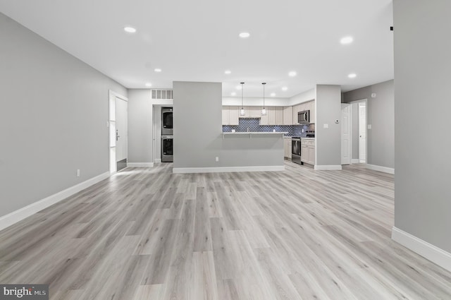 2 Stonehenge Cir Unit 2A-2, Baltimore, MD 21208 - unfurnished living room featuring recessed lighting and light wood-style flooring