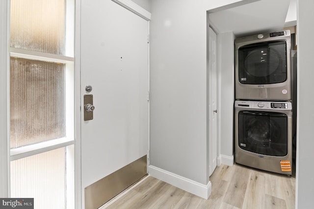 2 Stonehenge Cir Unit 2A-2, Baltimore, MD 21208 - washroom featuring stacked washer and clothes dryer and wood finished floors