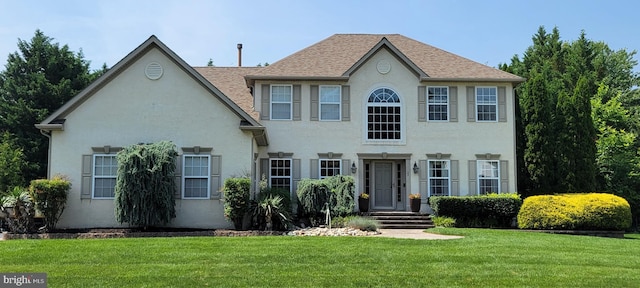 22 Millway Rd, Lumberton, NJ 08048 - colonial home featuring a front lawn, stucco siding, and roof with shingles