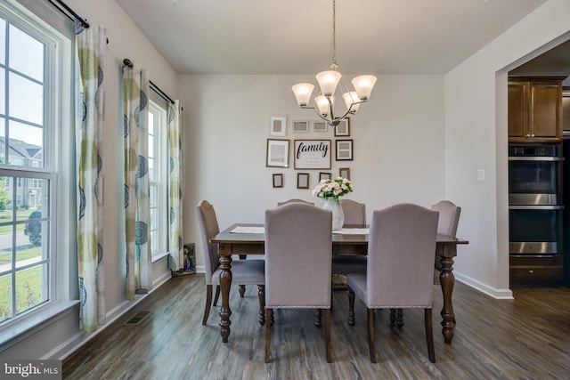 6647 Ballenger Run Blvd, Frederick, MD 21703 - dining area featuring dark wood-style flooring, healthy amount of natural light, and a chandelier