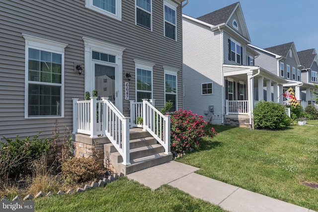 6647 Ballenger Run Blvd, Frederick, MD 21703 - doorway to property featuring a lawn and a residential view