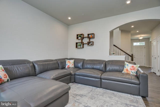 6647 Ballenger Run Blvd, Frederick, MD 21703 - living room with arched walkways, wood finished floors, recessed lighting, and stairway