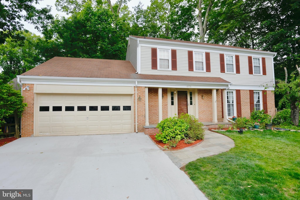 10731 Bear Oak Ct, Burke, VA 22015 - view of front of house with brick siding, concrete driveway, and a garage