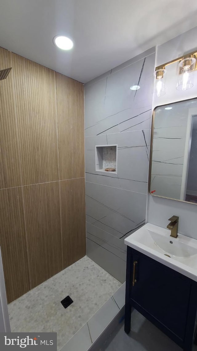 5155 8th St NE, Washington, DC 20011 - bathroom with vanity, tiled shower, and tile patterned floors