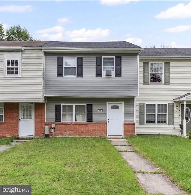 15 Willow Ct, Elkton, MD 21921 - townhome / multi-family property with brick siding, a front lawn, and cooling unit