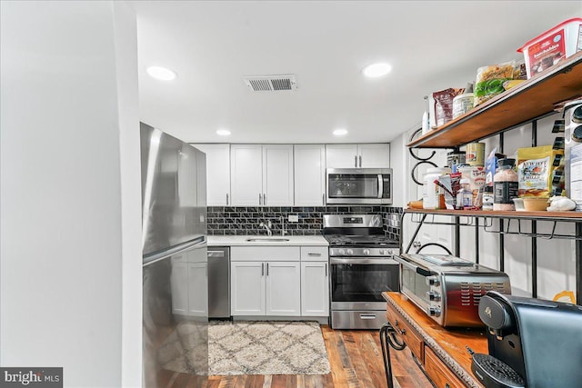 15 Willow Ct, Elkton, MD 21921 - kitchen with appliances with stainless steel finishes, light wood finished floors, white cabinetry, open shelves, and recessed lighting
