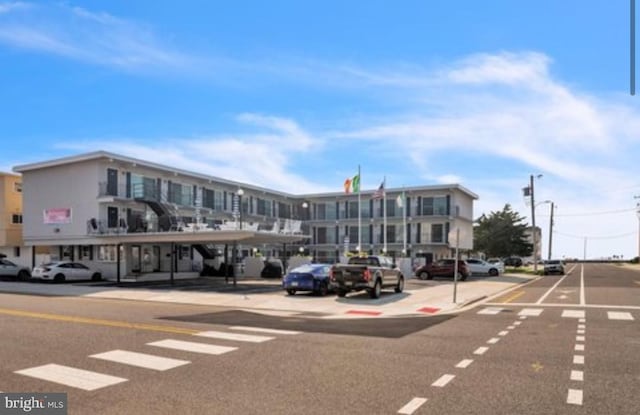 405 Ocean Ave Unit 110, Wildwood, NJ 08260 - view of building exterior with uncovered parking