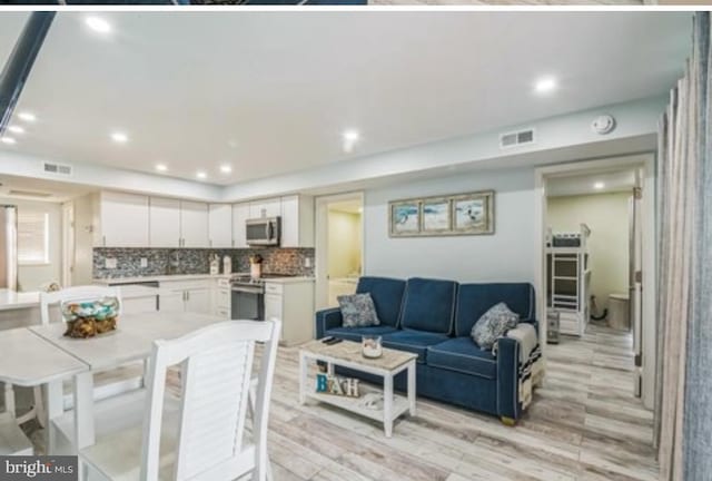 405 Ocean Ave Unit 110, Wildwood, NJ 08260 - living room featuring light wood-style floors and recessed lighting