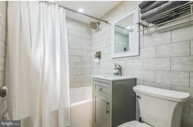 405 Ocean Ave Unit 110, Wildwood, NJ 08260 - bathroom featuring shower / bathtub combination with curtain, vanity, and tile walls
